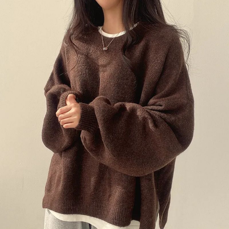 Woman wearing a cozy oversized knit sweater