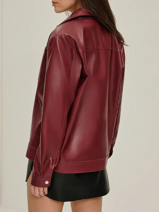 Woman wearing a burgundy faux leather jacket