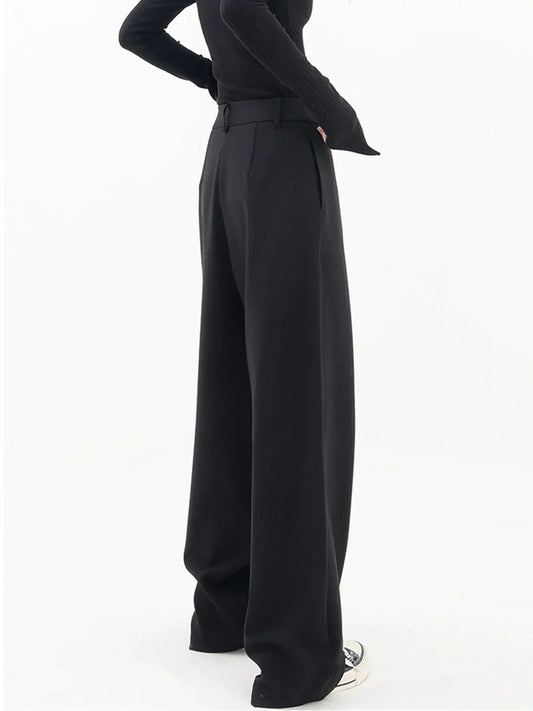 Woman wearing black wrap front wide leg pants