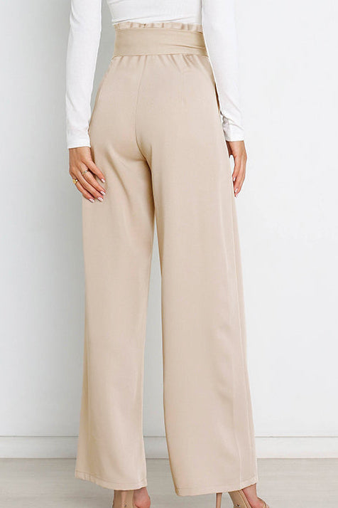 Woman wearing paperbag waist wide leg pants