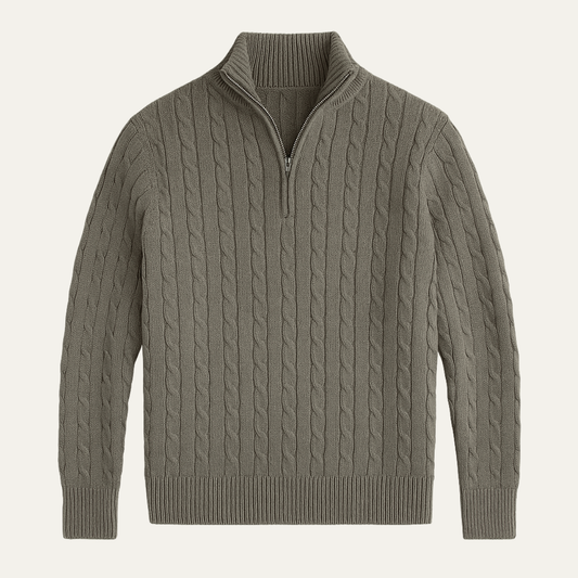 Man wearing a cable knit quarter zip sweater