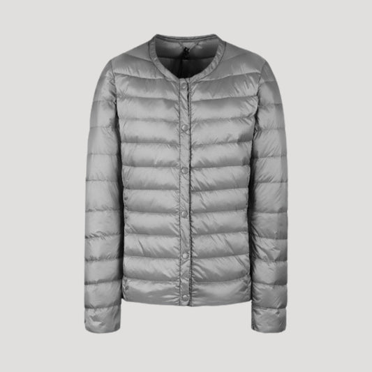 Woman wearing a lightweight collarless quilted puffer jacket