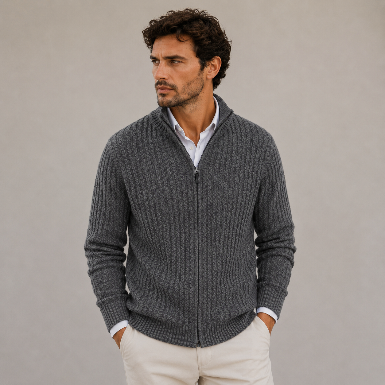 Man wearing a full zip textured knit sweater with stand-up collar
