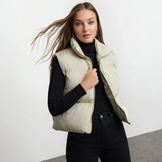 Woman wearing a lightweight quilted high collar vest