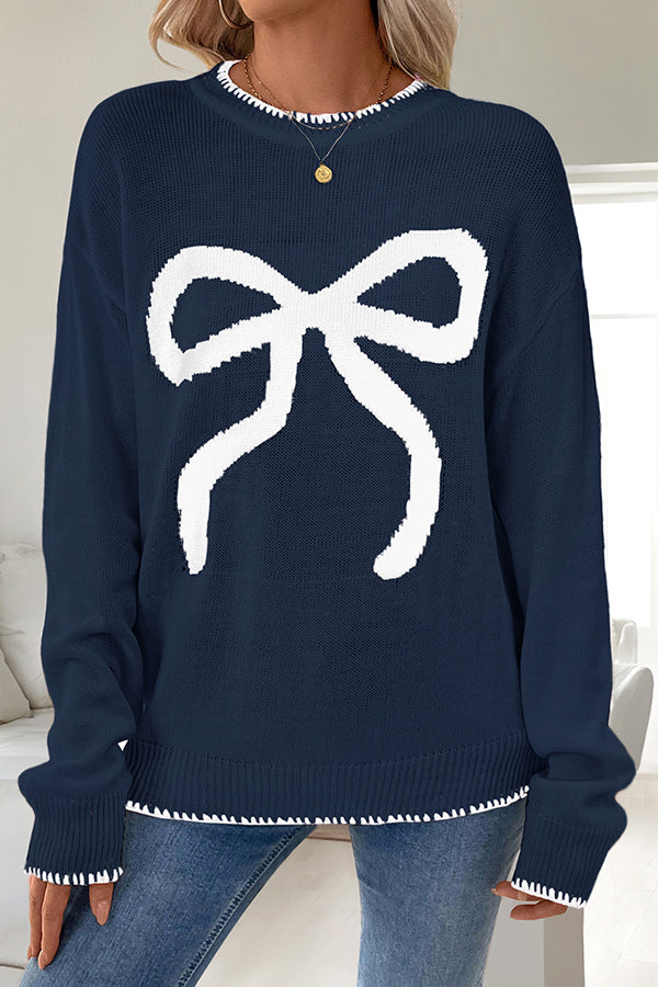 Woman wearing a cozy bow knit Christmas sweater