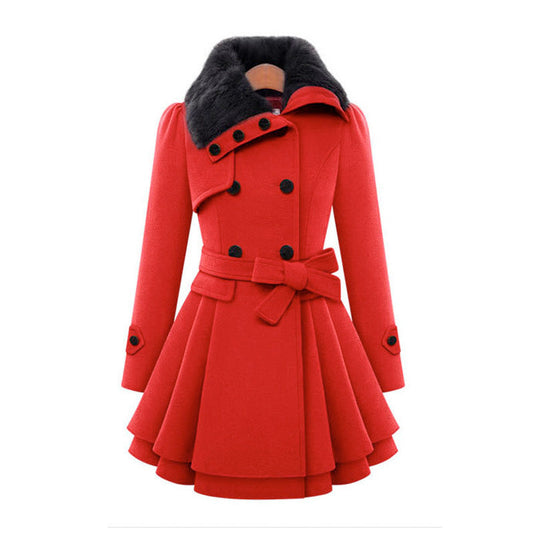 Woman wearing a double-breasted coat with a plush faux fur collar