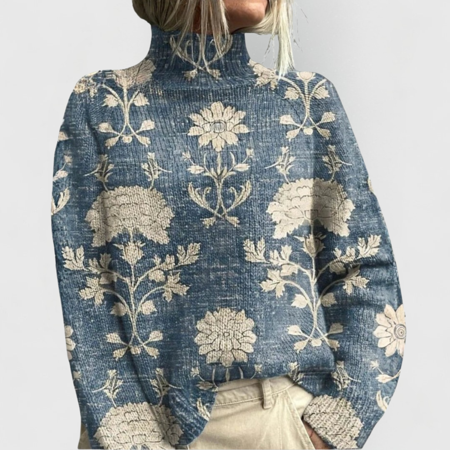 Woman wearing a printed turtleneck sweater with all-over artwork and ribbed cuffs
