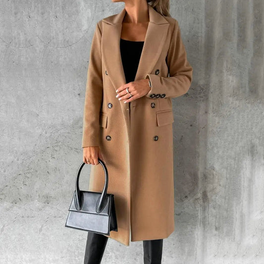 Woman wearing a longline double-breasted overcoat with notched lapel