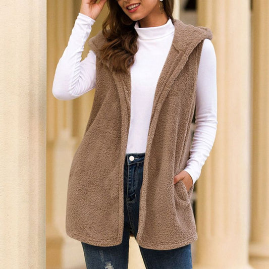 Woman wearing a hooded fleece vest with pockets