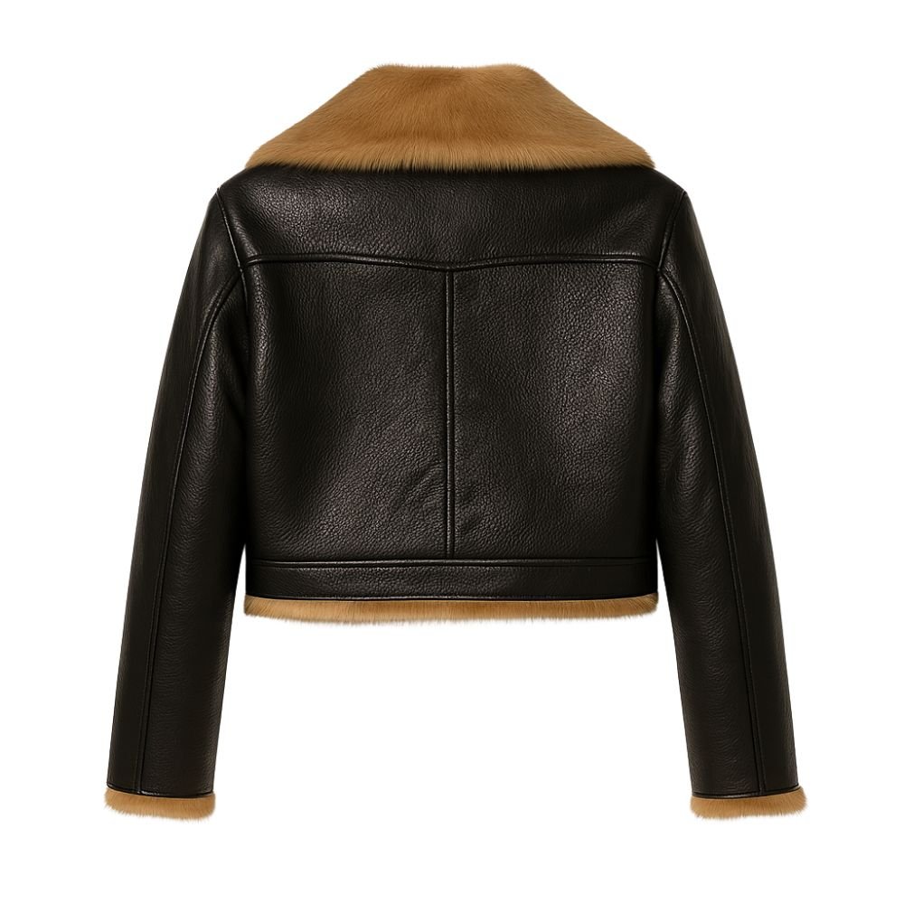 Woman wearing a cropped black faux leather aviator jacket with faux shearling collar