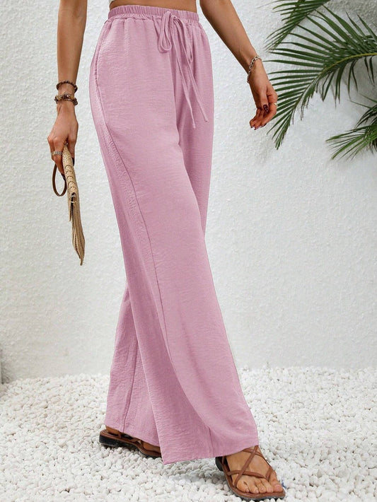 Woman wearing casual wide leg drawstring pants