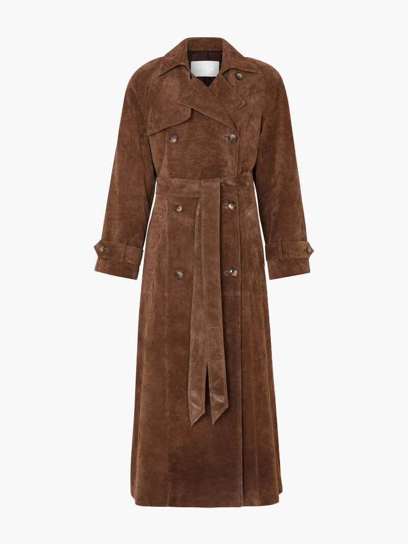 Woman wearing a long suede double-breasted belted trench coat