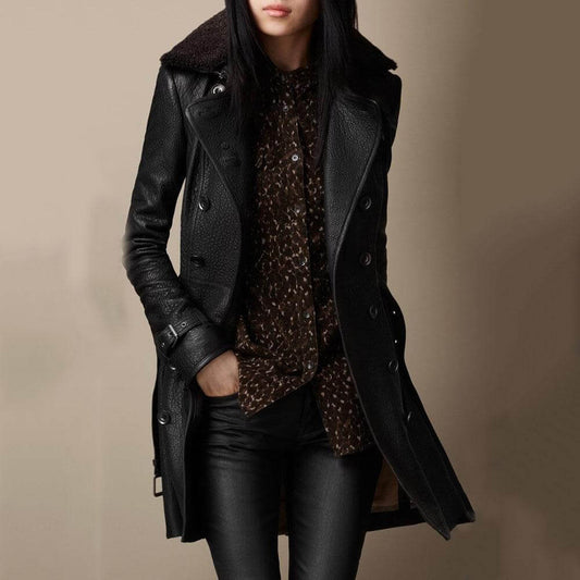 Woman wearing a black longline faux leather jacket
