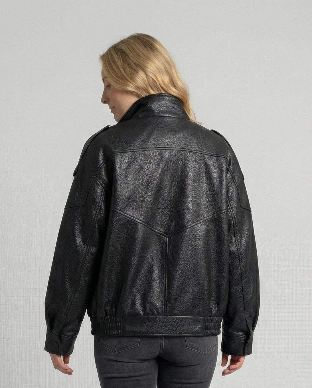 Woman wearing an asymmetric faux leather biker jacket