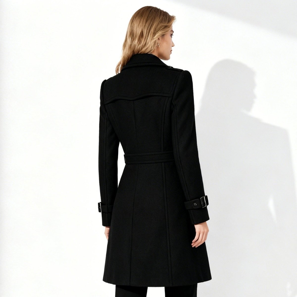 Woman wearing a tailored double-breasted wool coat with notched lapel