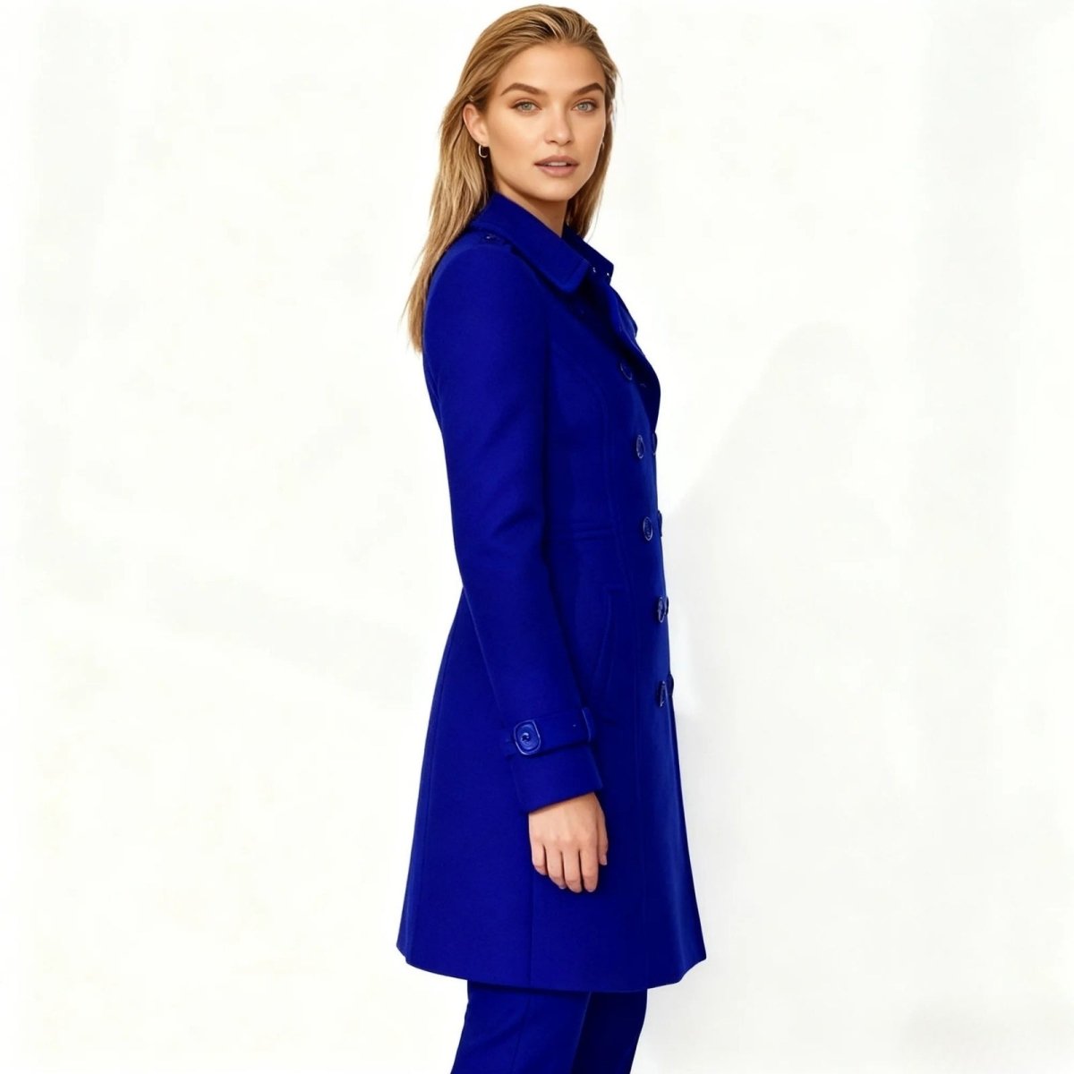 Woman wearing a tailored double-breasted wool coat with notched lapel