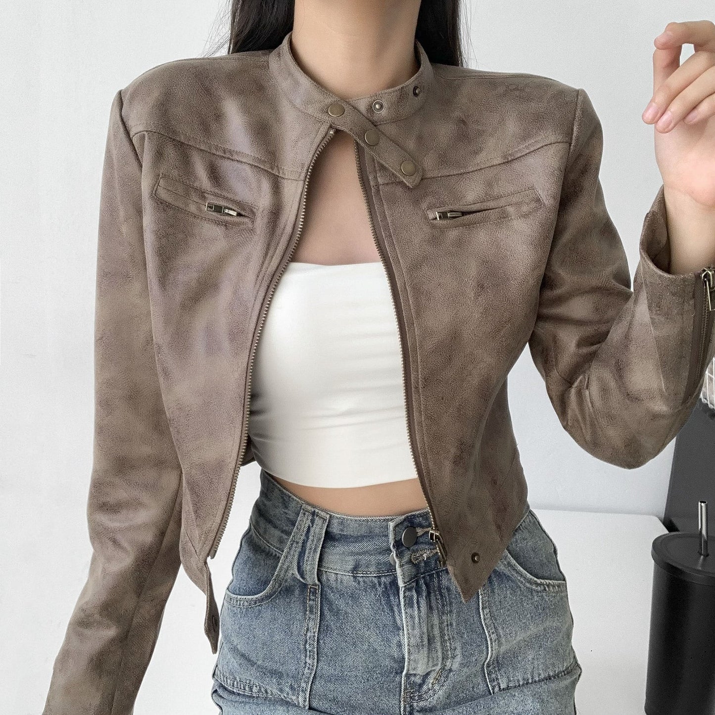 Woman wearing a cropped faux leather jacket