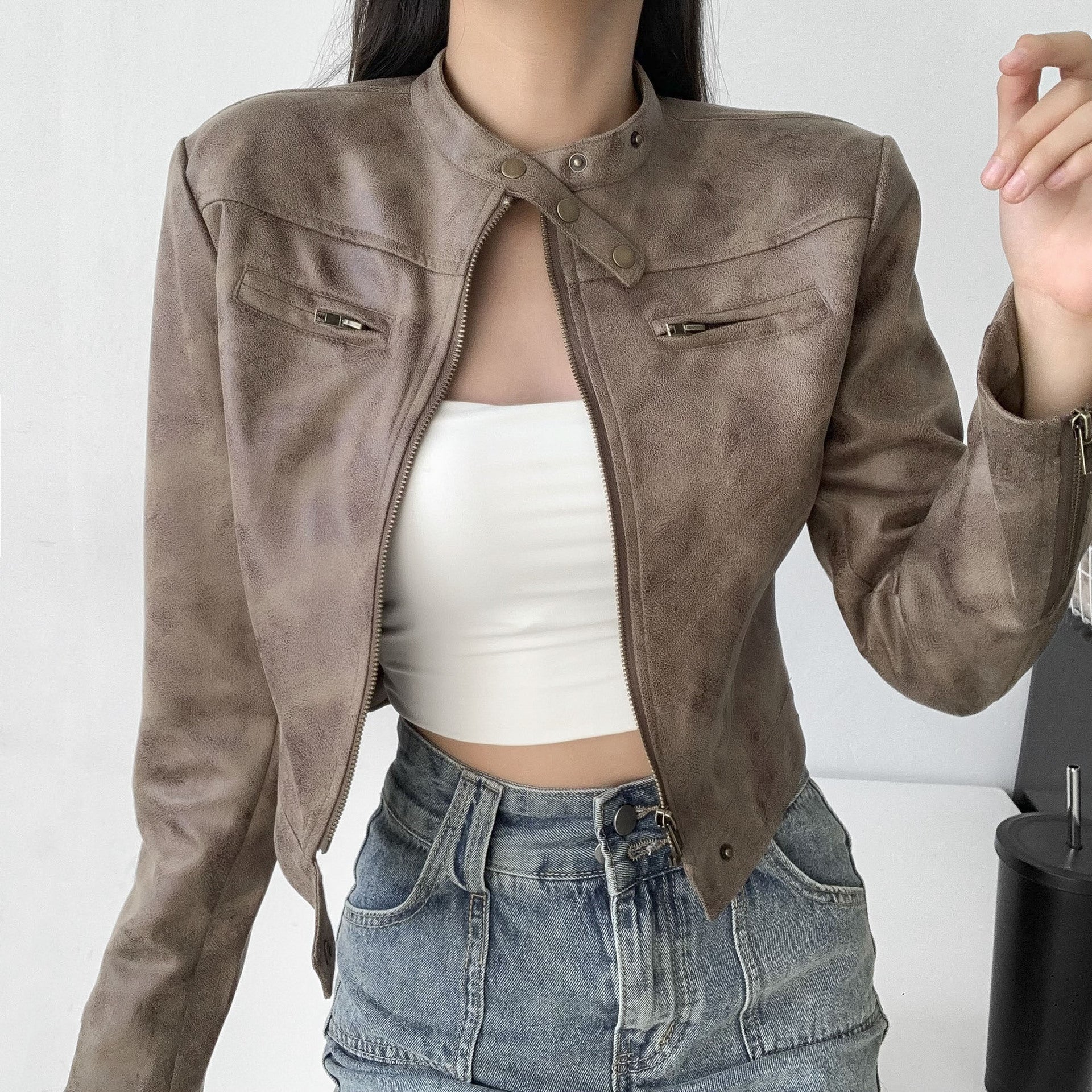 Woman wearing a cropped faux leather jacket