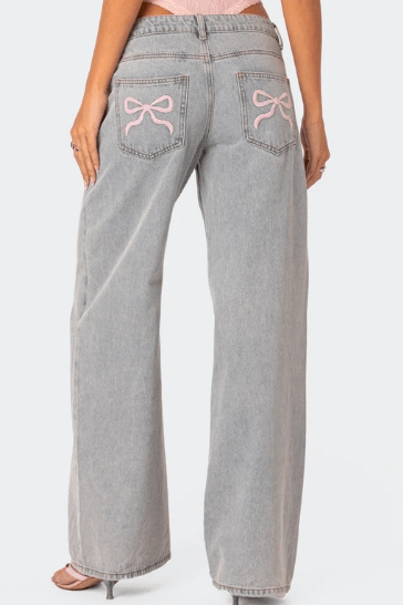 Woman wearing Beatrix bow pocket wide leg jeans