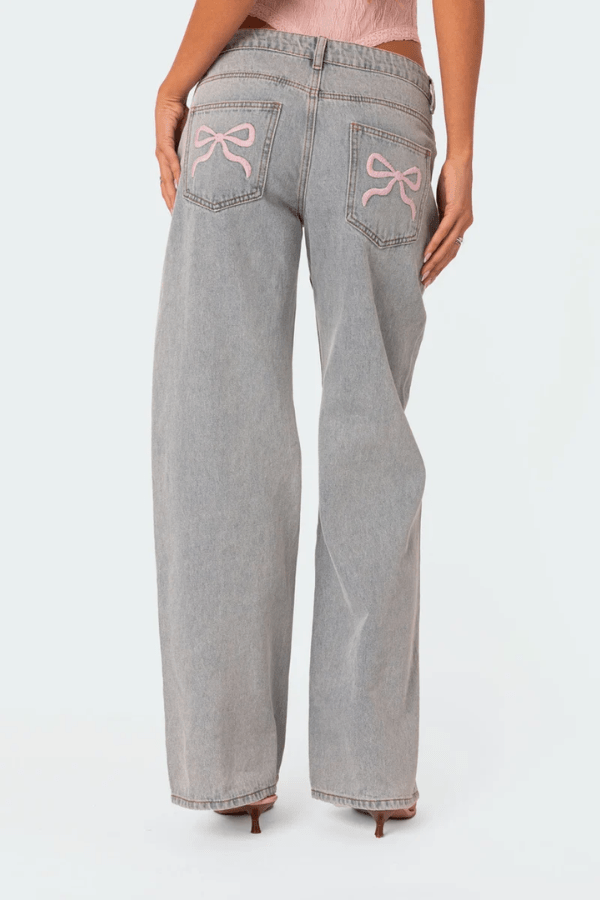Woman wearing Beatrix bow pocket wide leg jeans
