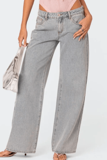 Woman wearing Beatrix bow pocket wide leg jeans