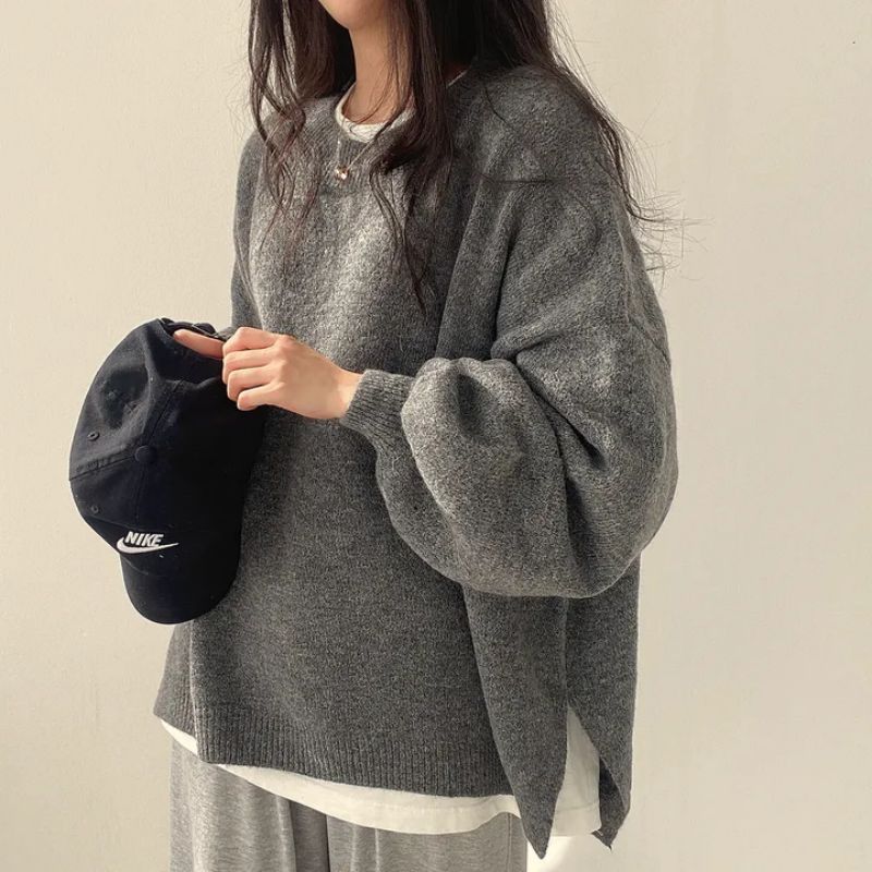 Woman wearing a cozy oversized knit sweater
