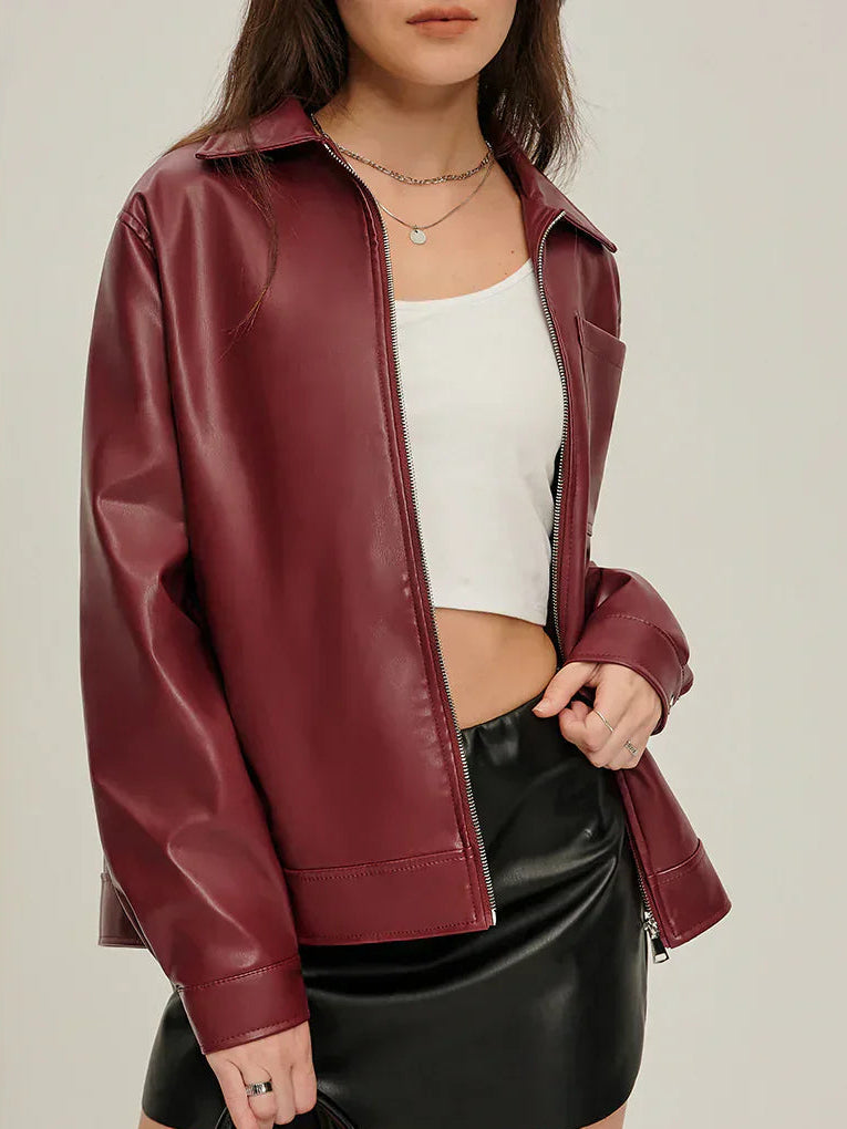 Woman wearing a burgundy faux leather jacket