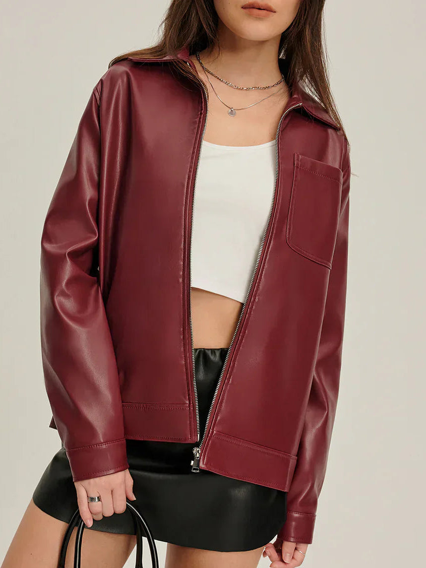 Woman wearing a burgundy faux leather jacket