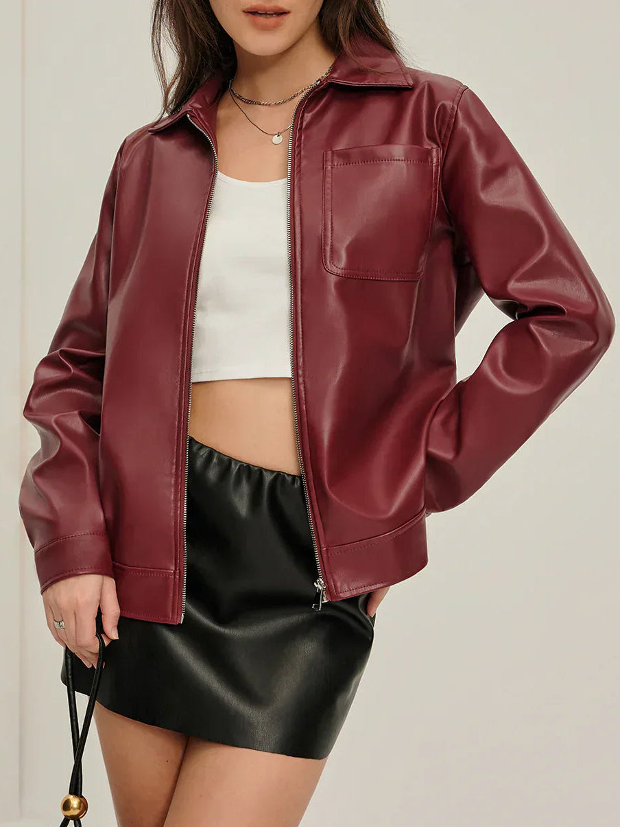 Woman wearing a burgundy faux leather jacket