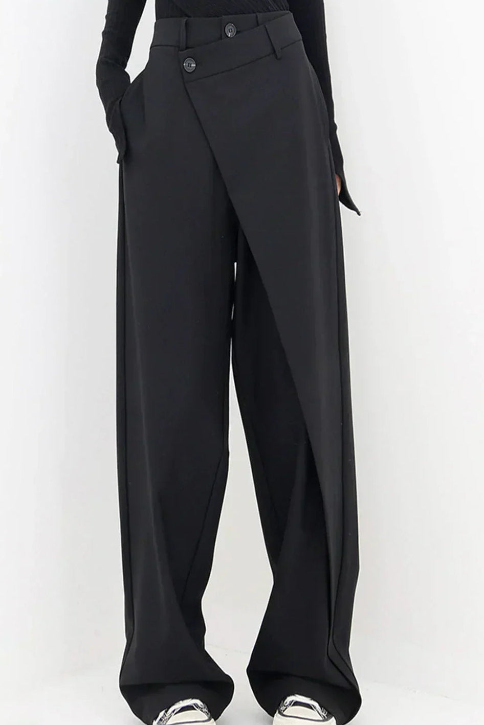 Woman wearing black wrap front wide leg pants