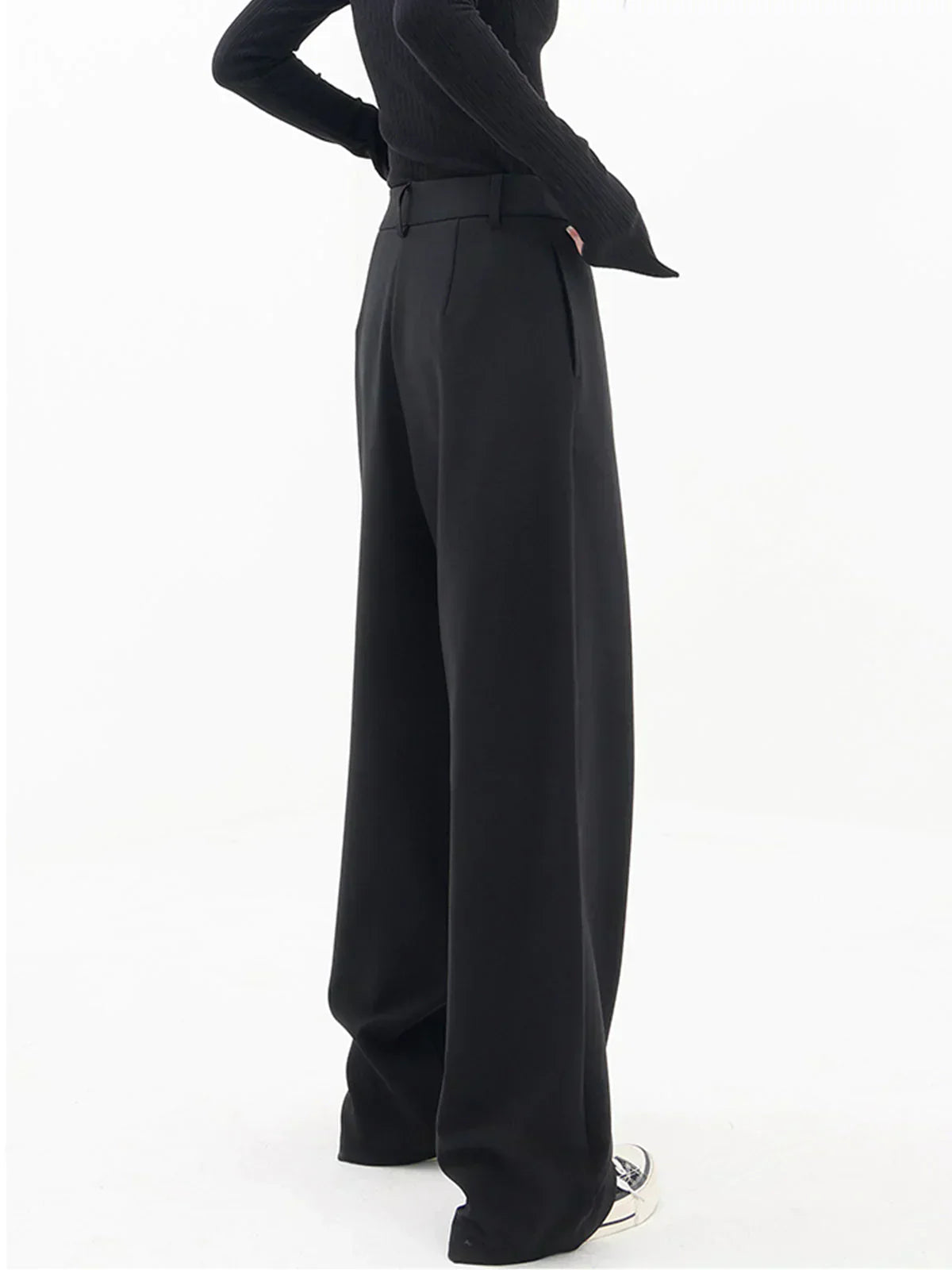 Woman wearing black wrap front wide leg pants