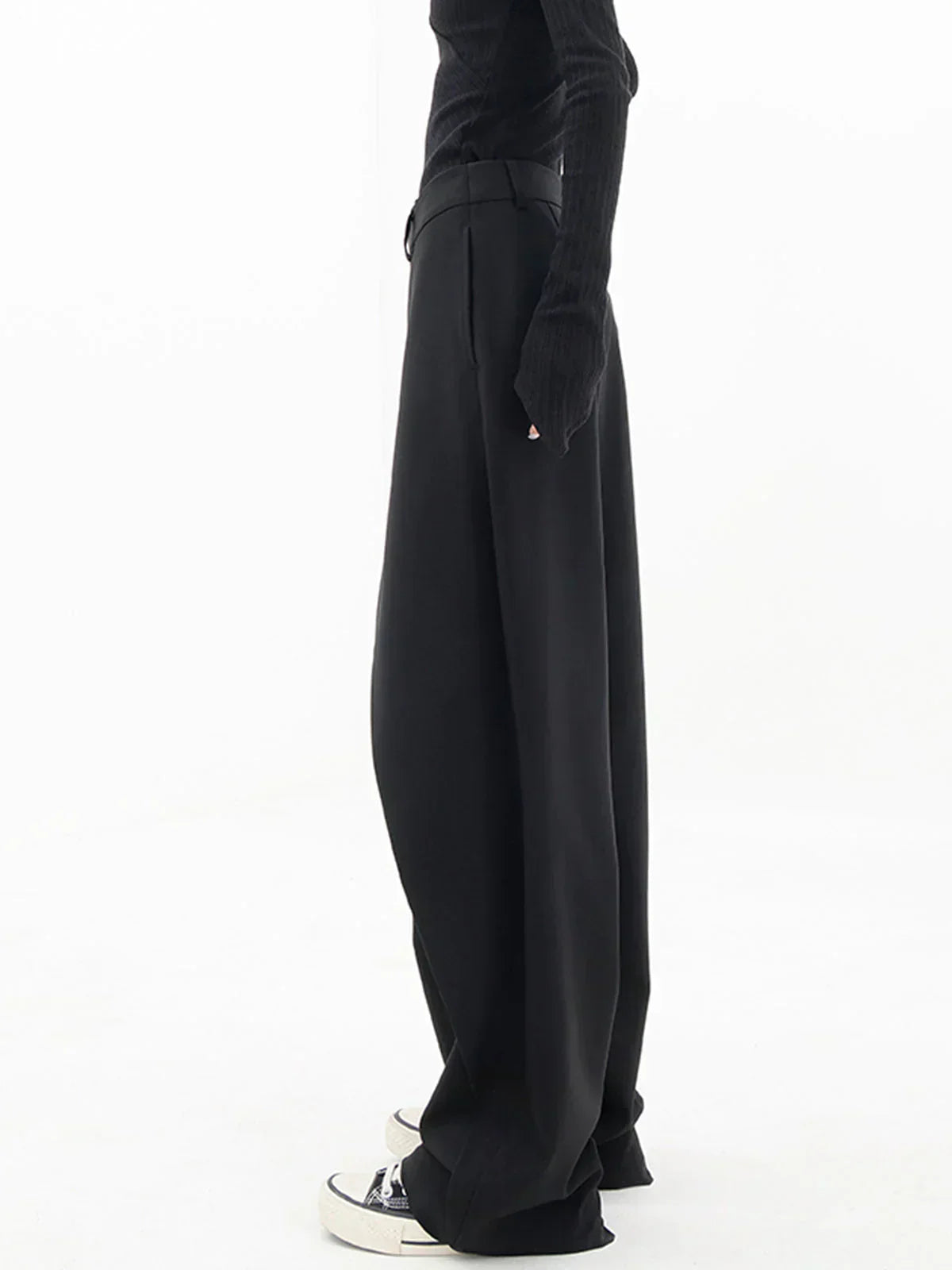 Woman wearing black wrap front wide leg pants