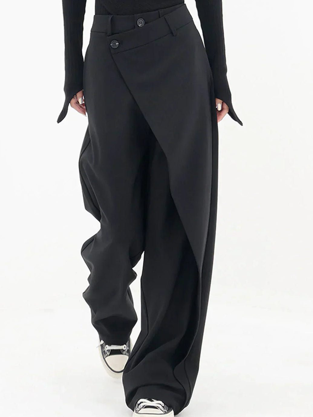 Woman wearing black wrap front wide leg pants