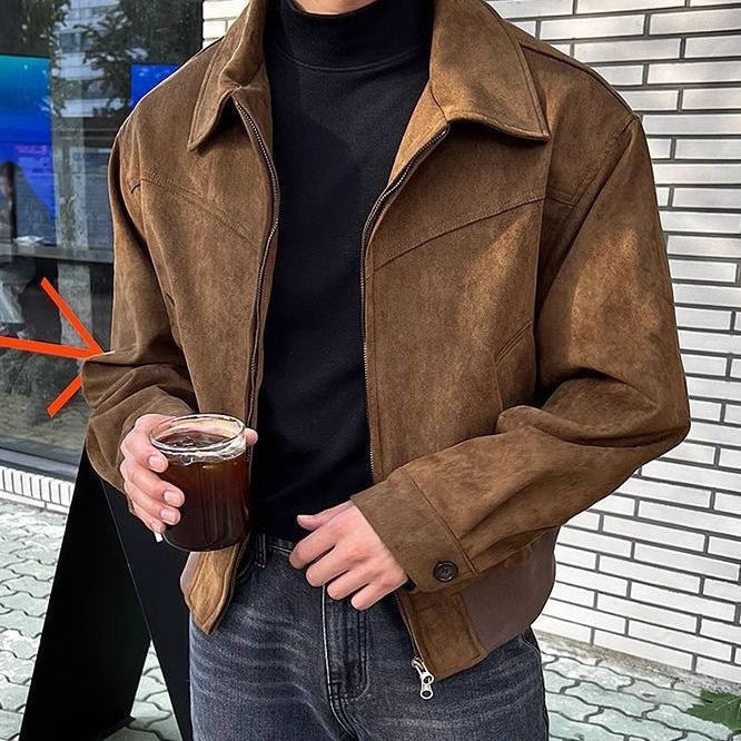 Man wearing a black faux leather zip jacket