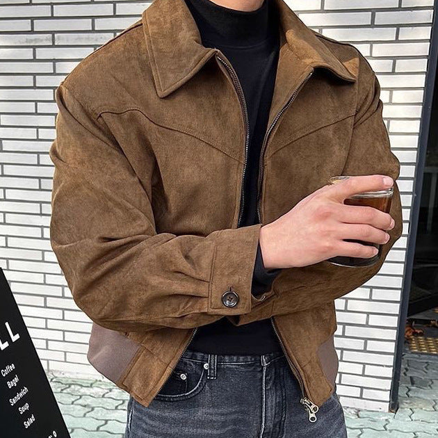 Man wearing a black faux leather zip jacket