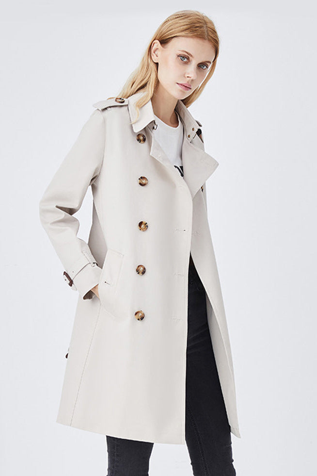 White slim fit belted trench coat for women.