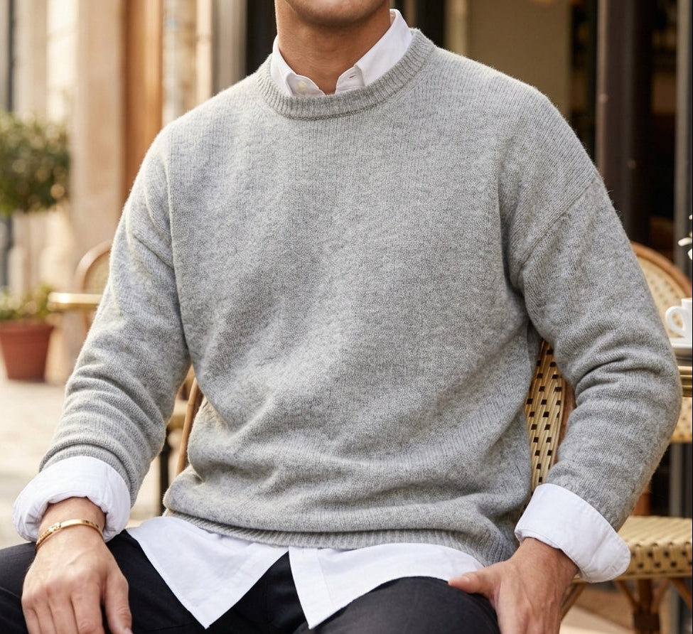 Man wearing a soft crewneck cashmere blend knit sweater over a collared shirt