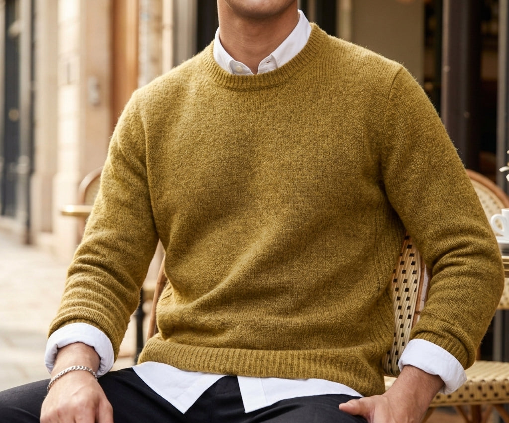 Man wearing a soft crewneck cashmere blend knit sweater over a collared shirt
