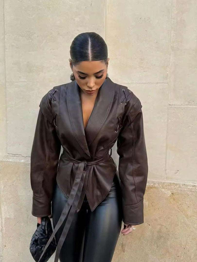 Woman wearing a faux leather blazer jacket