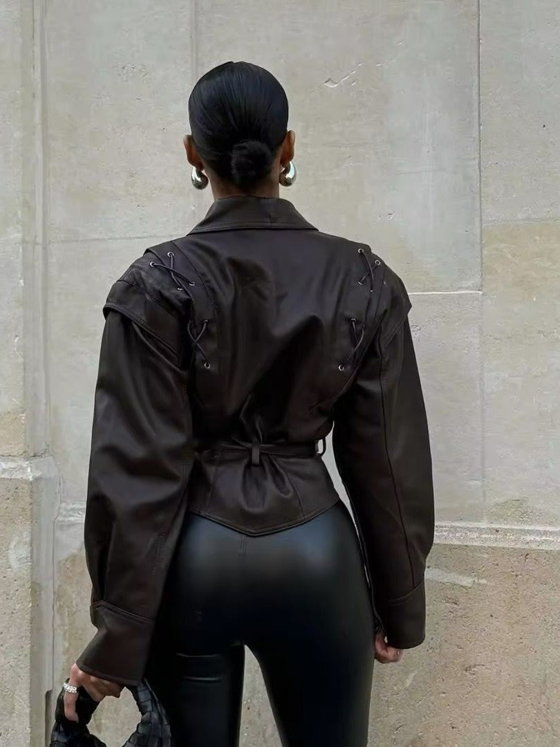 Woman wearing a faux leather blazer jacket