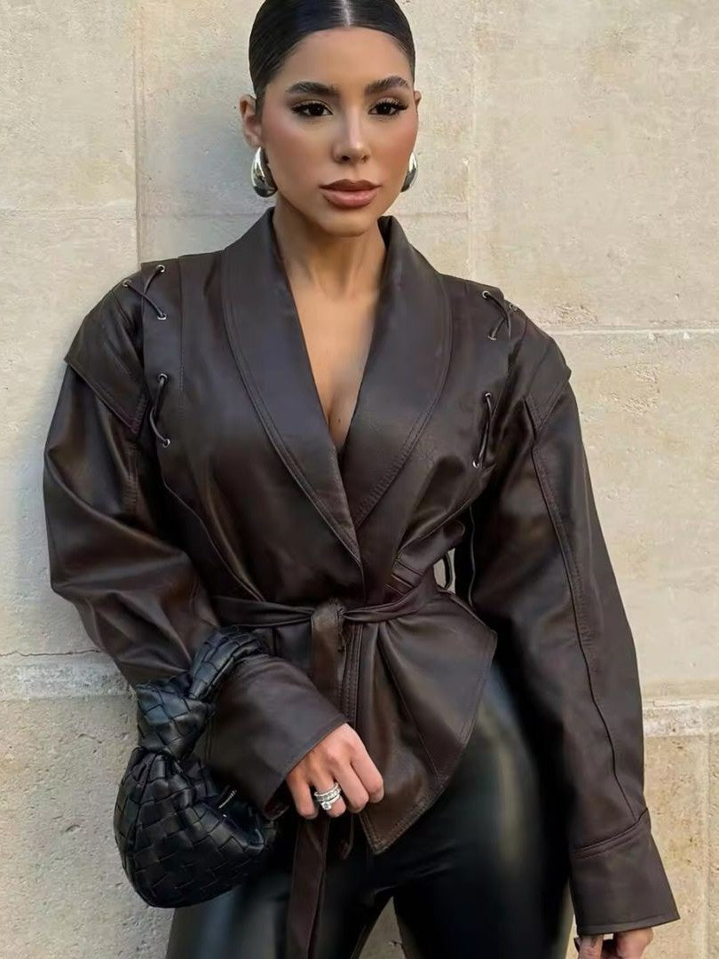 Woman wearing a faux leather blazer jacket
