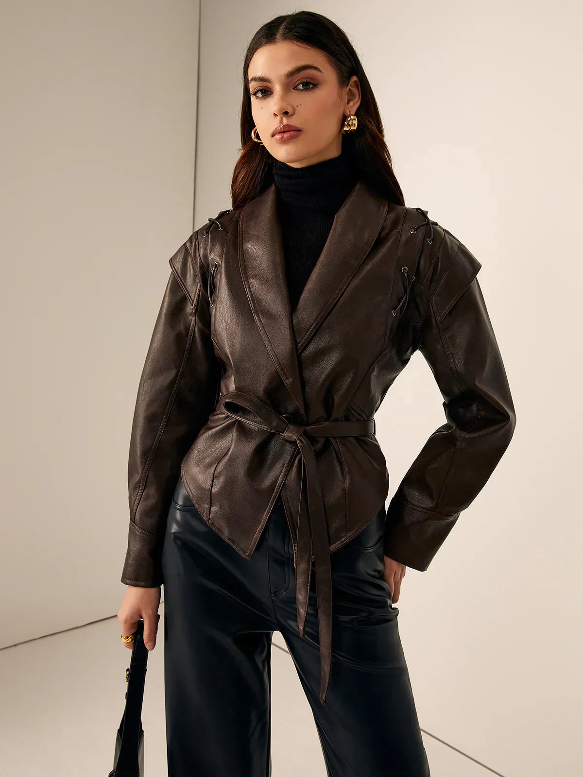 Woman wearing a faux leather blazer jacket