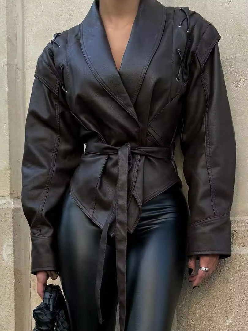Woman wearing a faux leather blazer jacket