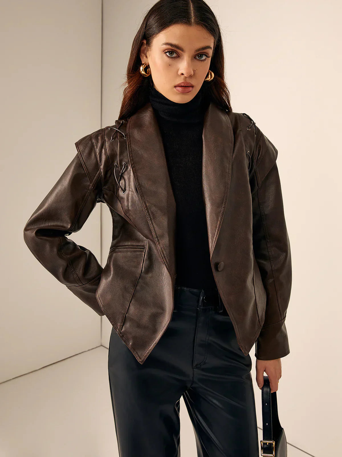 Woman wearing a faux leather blazer jacket