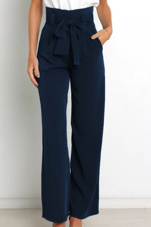 Woman wearing paperbag waist wide leg pants