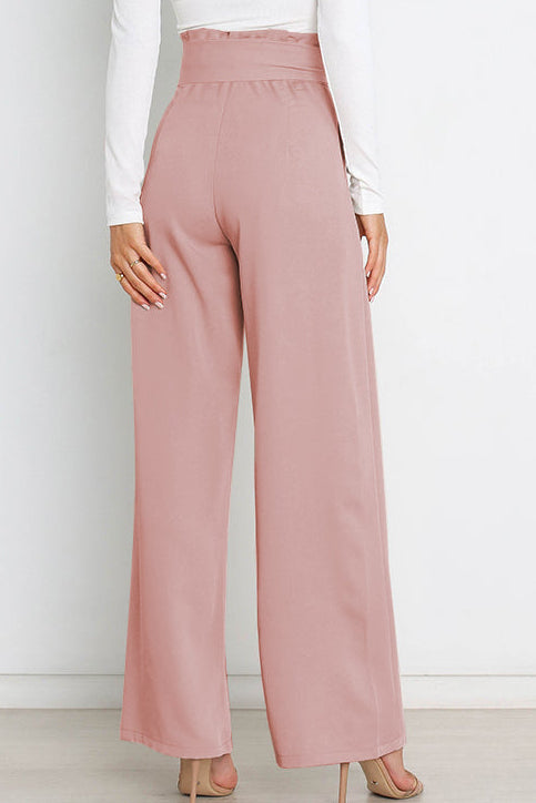 Woman wearing paperbag waist wide leg pants