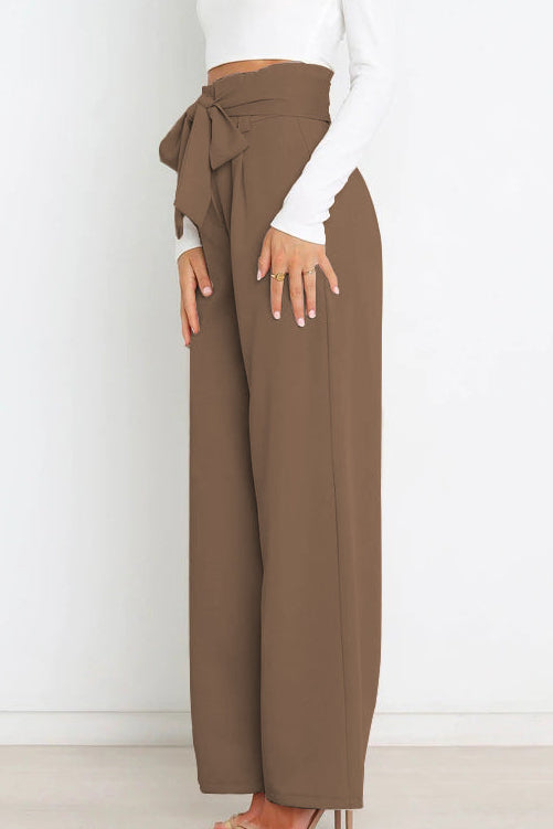 Woman wearing paperbag waist wide leg pants