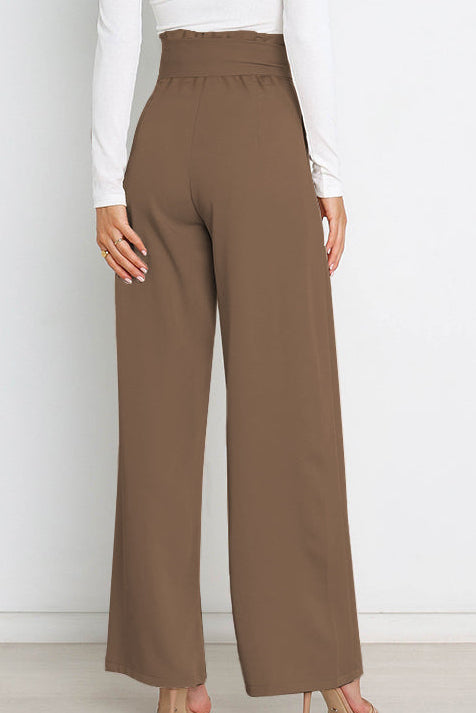 Woman wearing paperbag waist wide leg pants