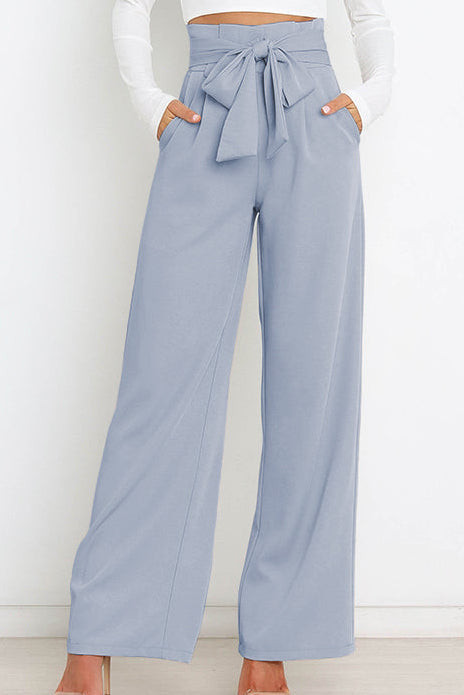 Woman wearing paperbag waist wide leg pants