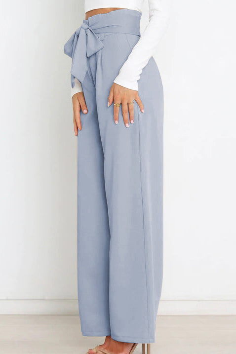 Woman wearing paperbag waist wide leg pants